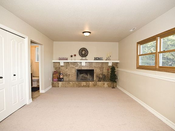 Living room has a wood burning fireplace!