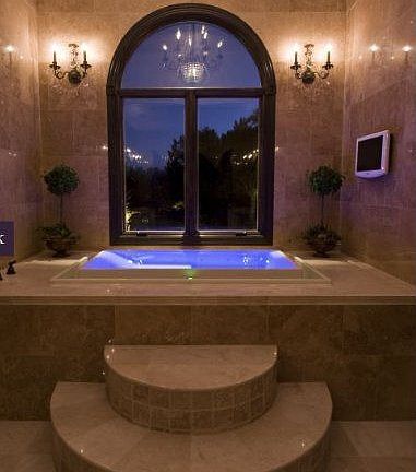 Bathroom with Infinity Tub Travertine Marble walls