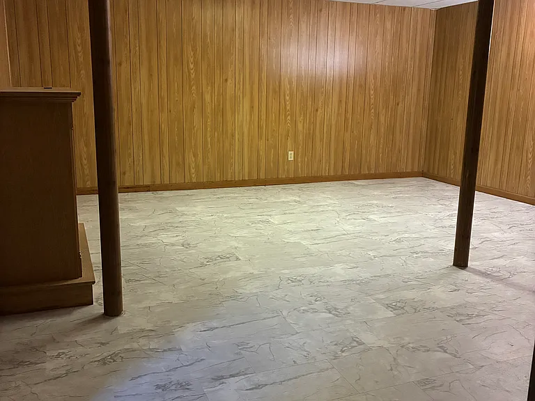 Additional view of the finished basement, showing the spacious layout and flexible additional living area.