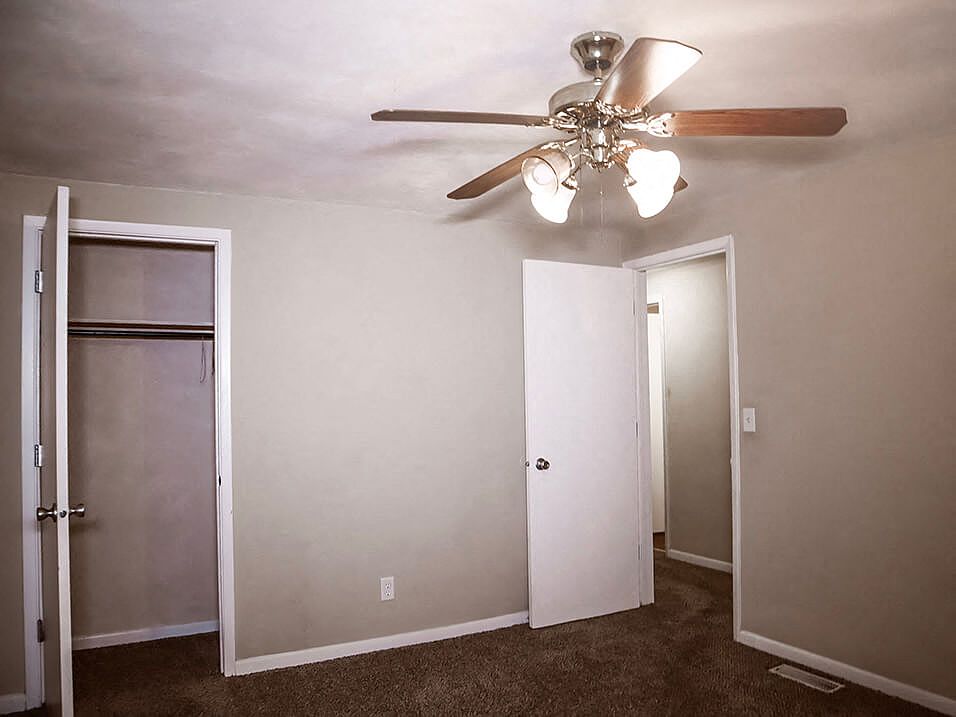 Bedroom With Overhead Light and Fan!