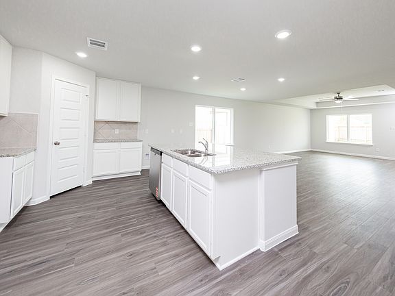 Kitchen to Dining Area and Family Room