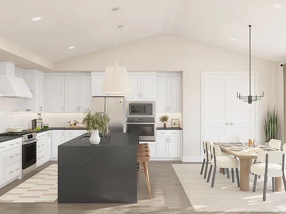 Vaulted ceiling throughout kitchen, dining area great room