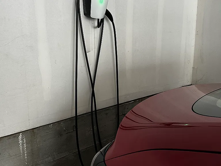 Dedicated Tesla Universal Wall Connector (for all EV charging) in garage.
