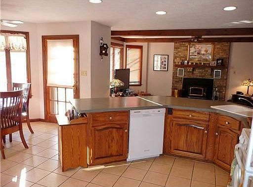Octagonal breakfast area in kitchen with door to deck.