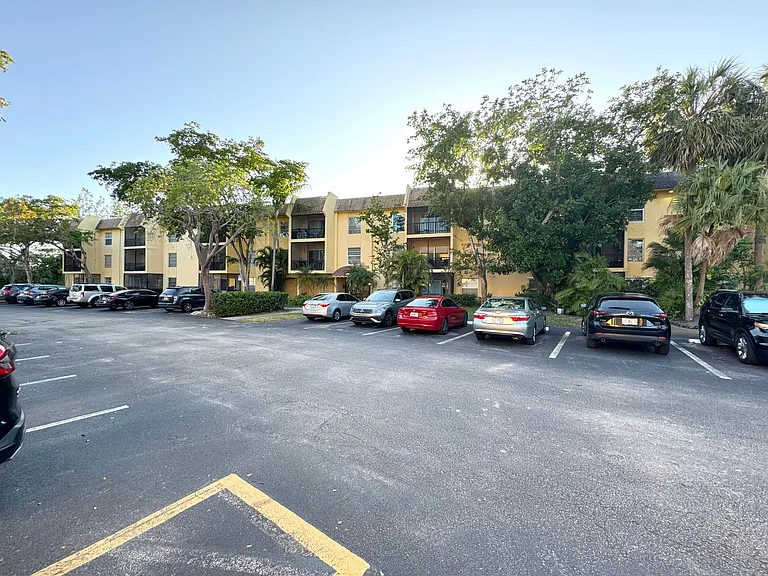 View from front of the condo leading to the secure foyer, hallway and then apartment