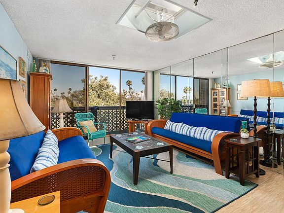 Open and airy living room with flat screen smart TV