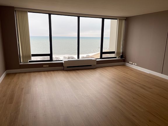 Living room with new Hardwood Flooring and Fresh Paint.