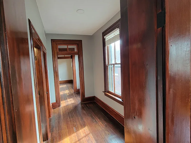 From the Bedroom door, see the hallway, entry way, kitchen and then living room. Tons of space!