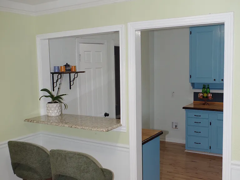 View from breakfast bar into the kitchen
