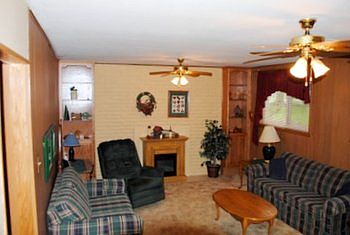 The family room offers lots of space and a wood burning fireplace too.