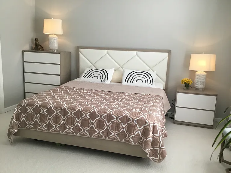 Master bedroom with king size bed, nightstands, dresser, chest of drawer