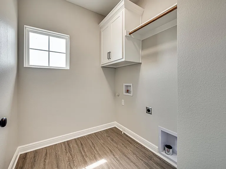 The laundry room is up for your convenience. It is set up for full-size washer and dryer. Locating on the left side as you arrived upstairs.