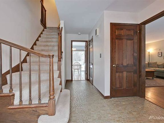 The large central foyer leads to the Living Room,\nformal Dining Room, large Kitchen and Breakfast a