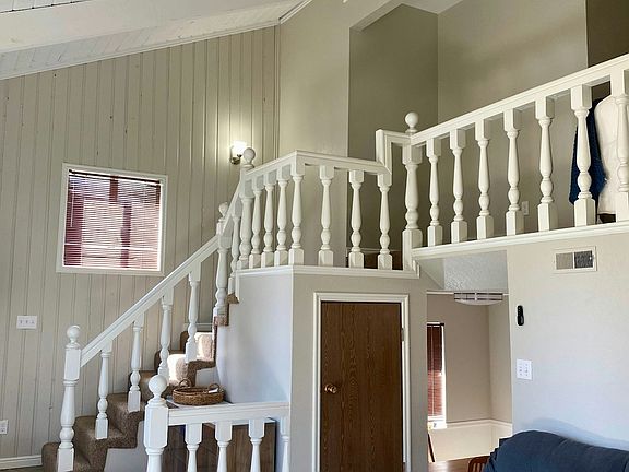 Stairs leading to 3 bedrooms