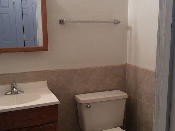 Downstairs half bath has ceramic tile
