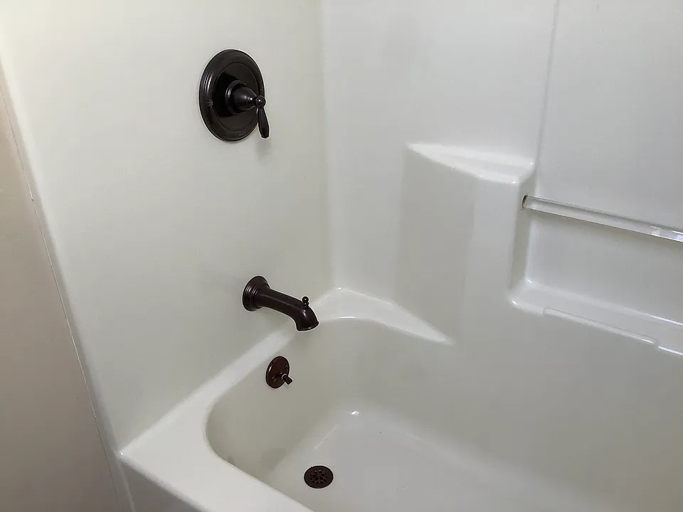 Bathtub with shower.