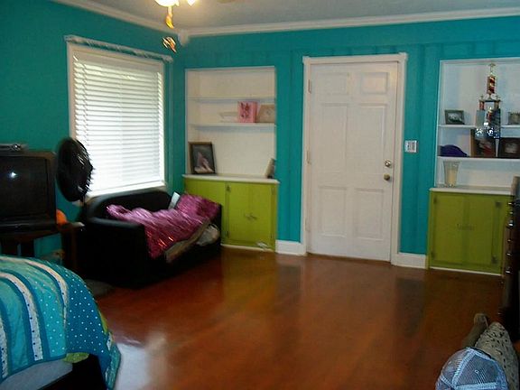 Large Bedroom with original wood floors beautifully redone