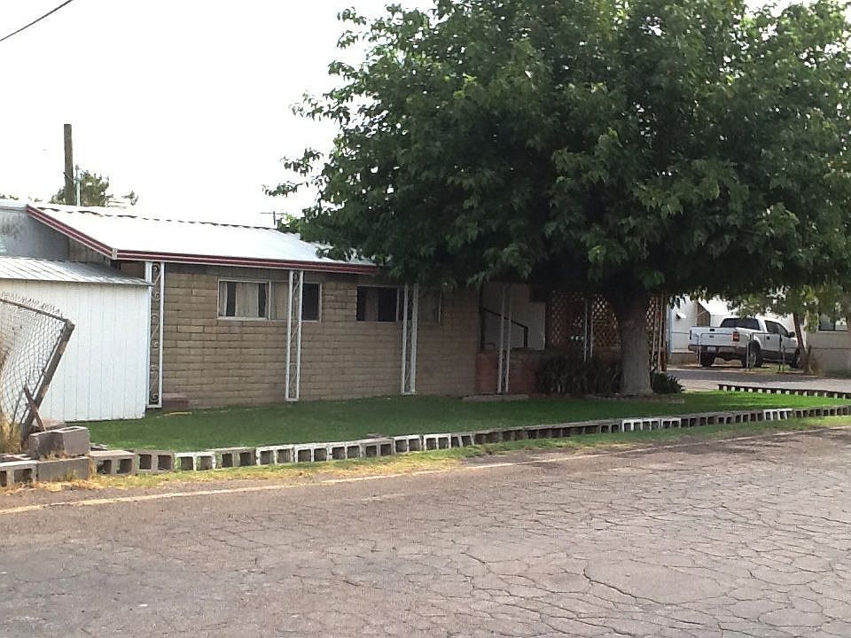 Brick add on room and storage in back.