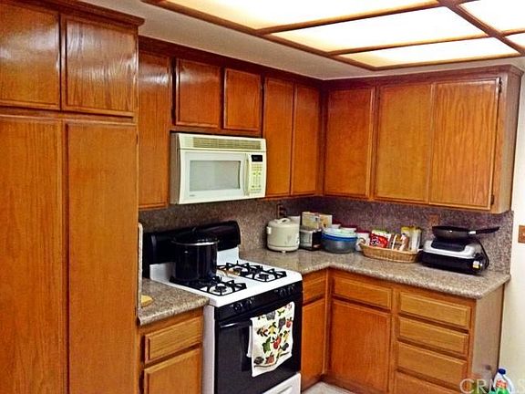 open kitchen with new countertops and plenty of storage