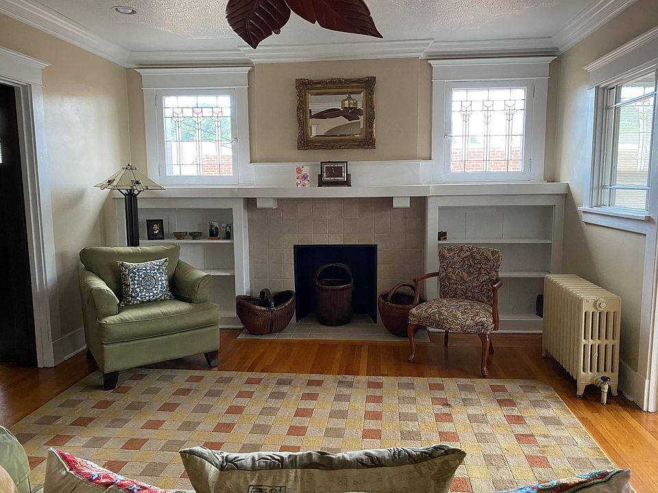 Living Room with fireplace and two stain glass windows!