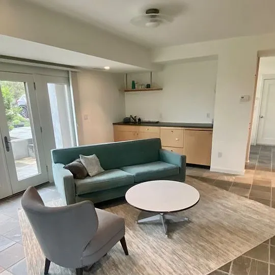 Downstairs living area with mini-kitchen/wet bar.