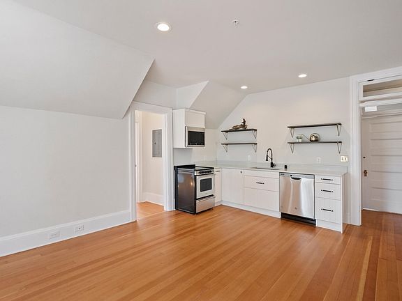 Kitchen (refrigerator and pantry adjacent to door)