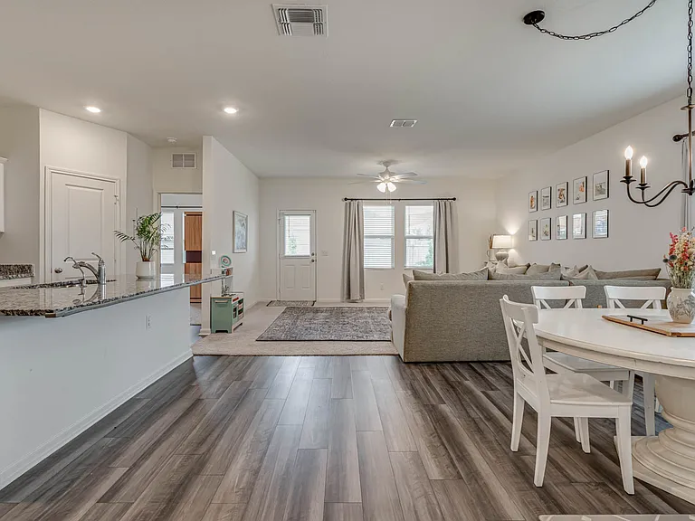 Amazing open concept that integrates the kitchen, dining, and family room. The set up is great for littles. It also has great light!