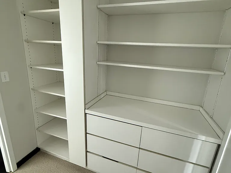 Huge newer walk-in closet connects bedroom to bathroom.