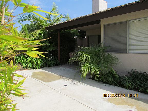 Fenced rear yard with large patio