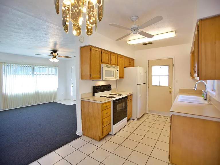 View from dining area to kitchen and living room