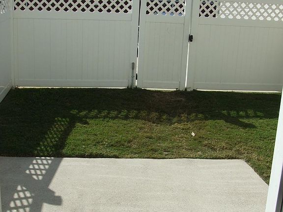 back patio, fence, parking through gate