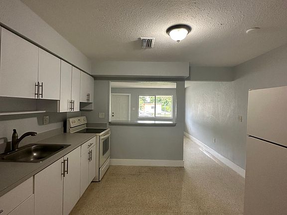 Eat in kitchen with an extended counter that fits 3 chairs