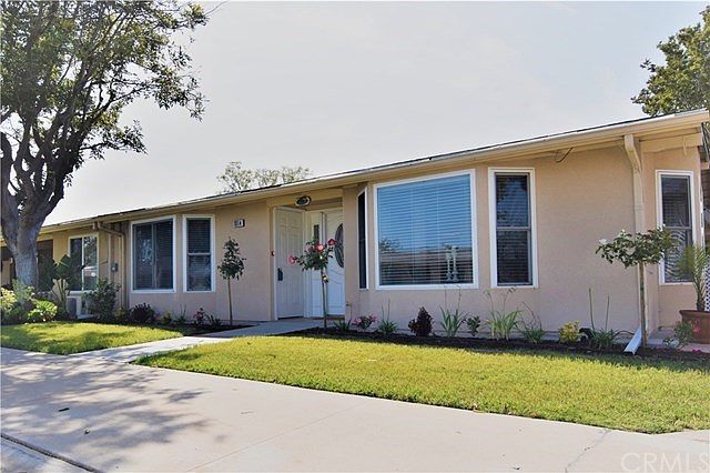 Fresh New Landscape with automatic sprinkler system, central location with greenbelt views and light, bright and south facing corner unit!