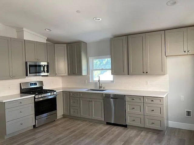 There's plenty of cabinet space for kitchen use. Vinyl planks are throughout the unit.