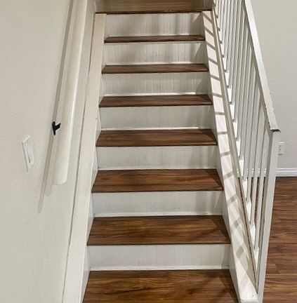 Stairs at entry. Living room to the right of stairs.