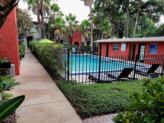 From the bottom of the steps to the condo looking at the pool.