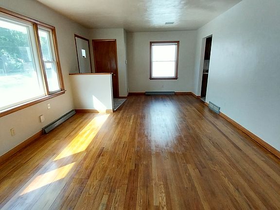 Living room with refinished natural hardwood floor