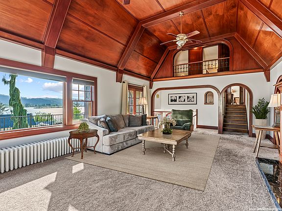 Stunning mahogany paneling and millworker frame the expansive windows, taking in the light and the views