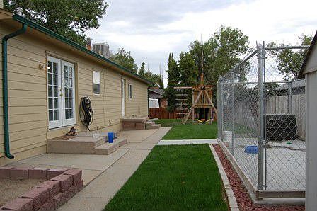 Back yard features a 6 ft privacy fence and an automatic sprinkler system