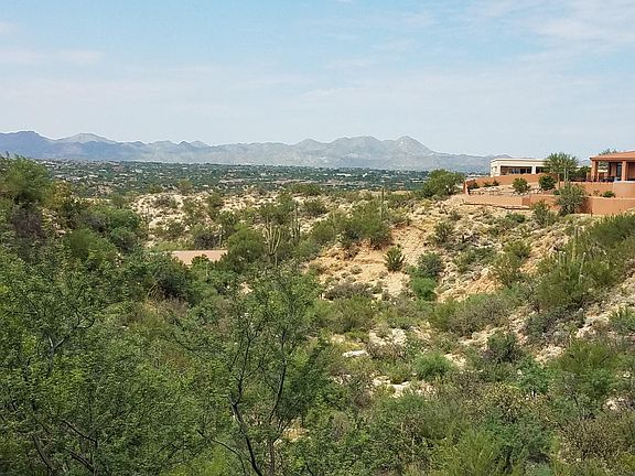 Views of the mountains and Oro Valley from the Living room, primary bedroom and terrace.