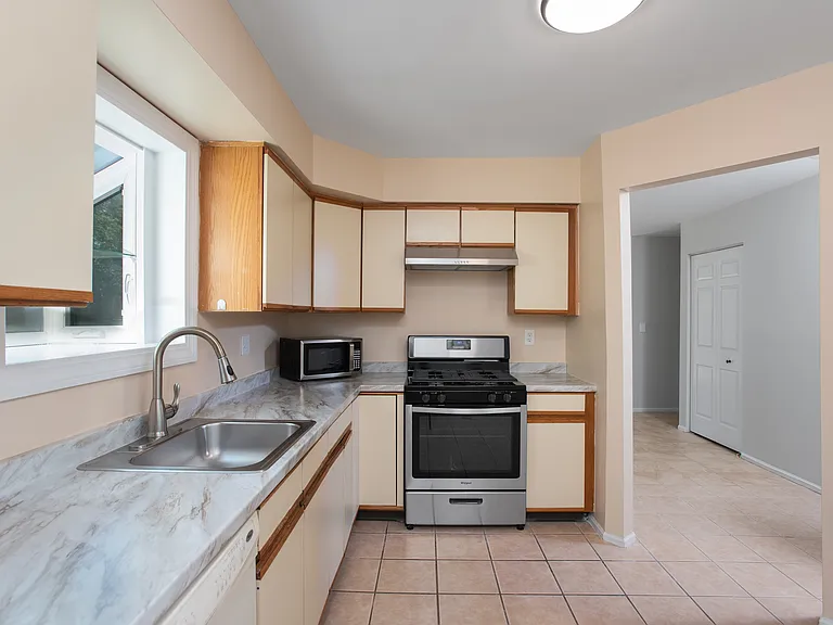 Gas stove and exhaust fan 4 years old. Microwave not included