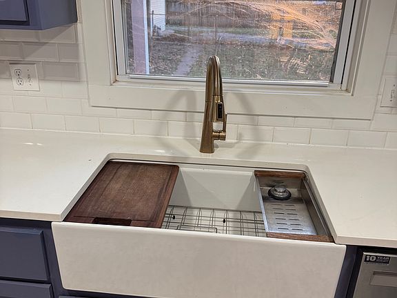 Sink with cutting board and drying rack
