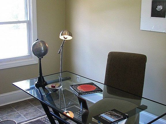 Sunny office or bonus room adjacent to the living room, overlooks front and back yards.