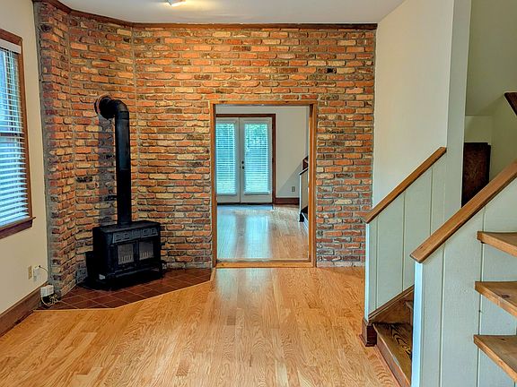 Front room with cast iron stove. Pocket divider glass and wood door not shown in pic.