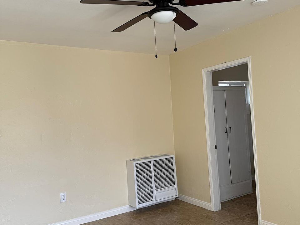 Living area with fan and wall heater