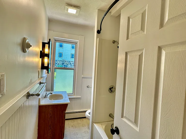 Full bathroom with clean, updated finishes