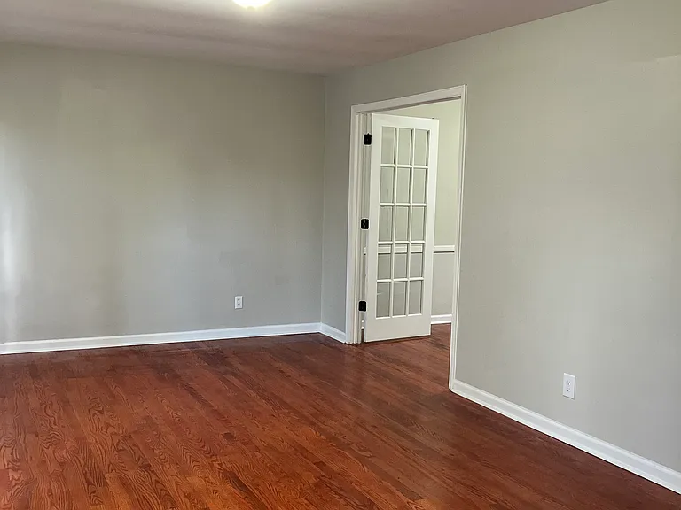 Livingroom viewing into the dining room with french doors