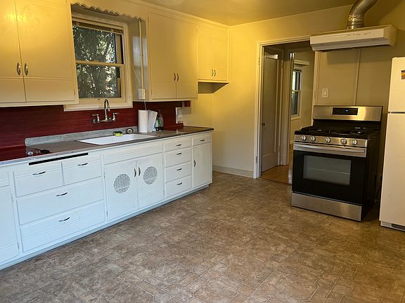 Kitchen with stove and fridge