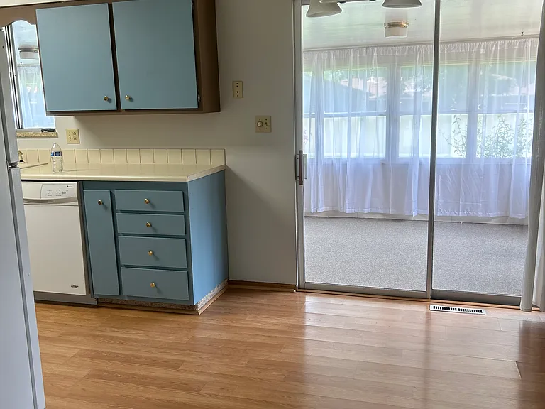 sliding glass doors that lead to the large sunroom