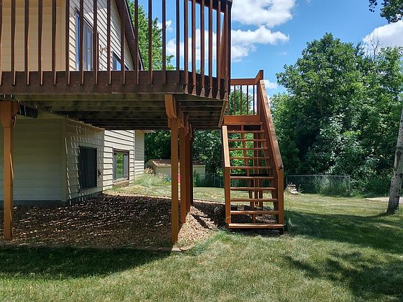 Spacious back deck, perfect for enjoying the large yard!